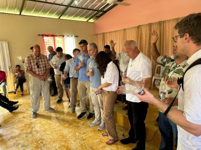 Group praying in a church.